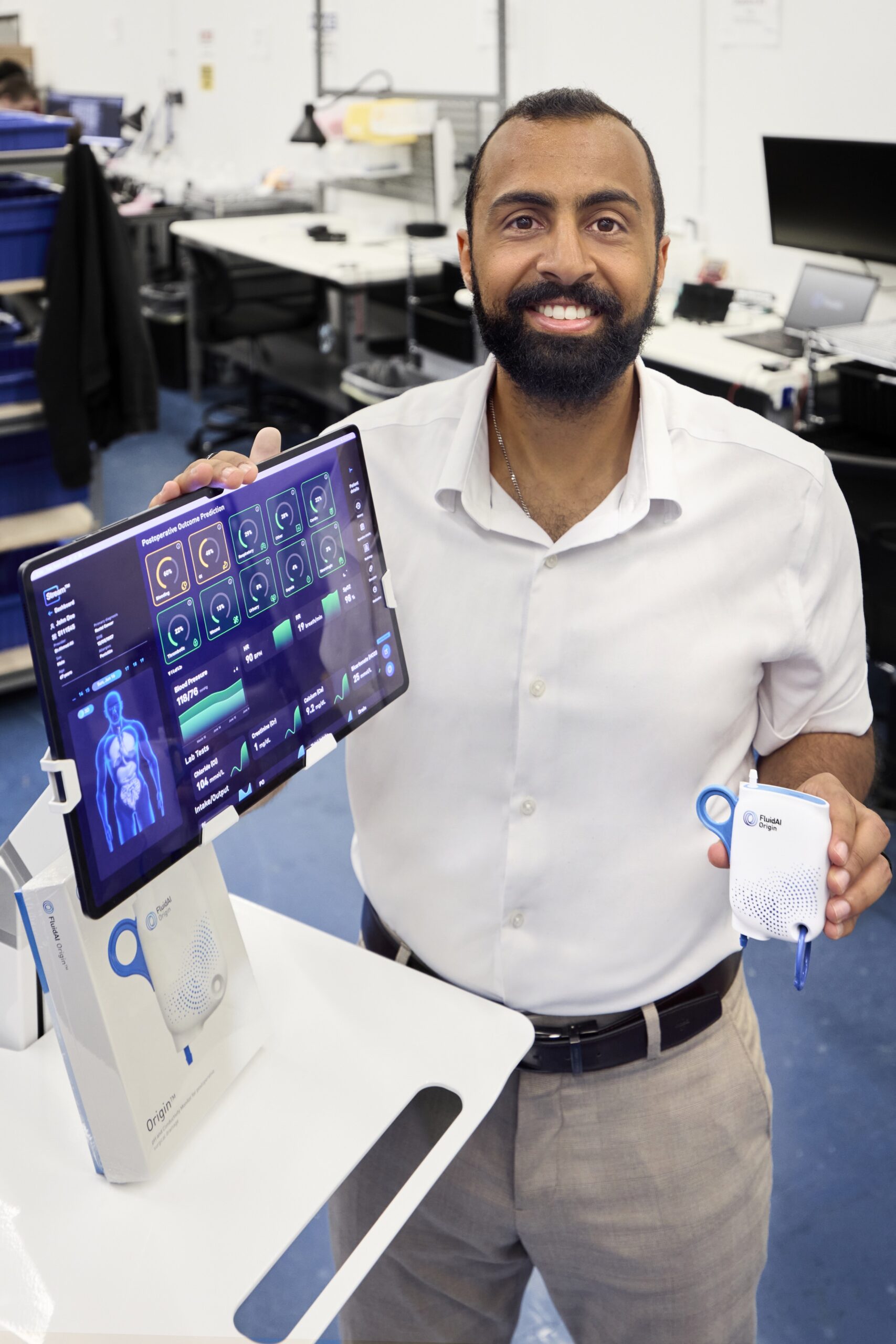 Amr Abdelgawad with FluidAI device and monitor screen