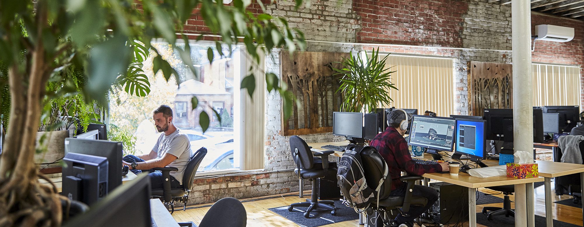 Creatives working at their computers in an office setting