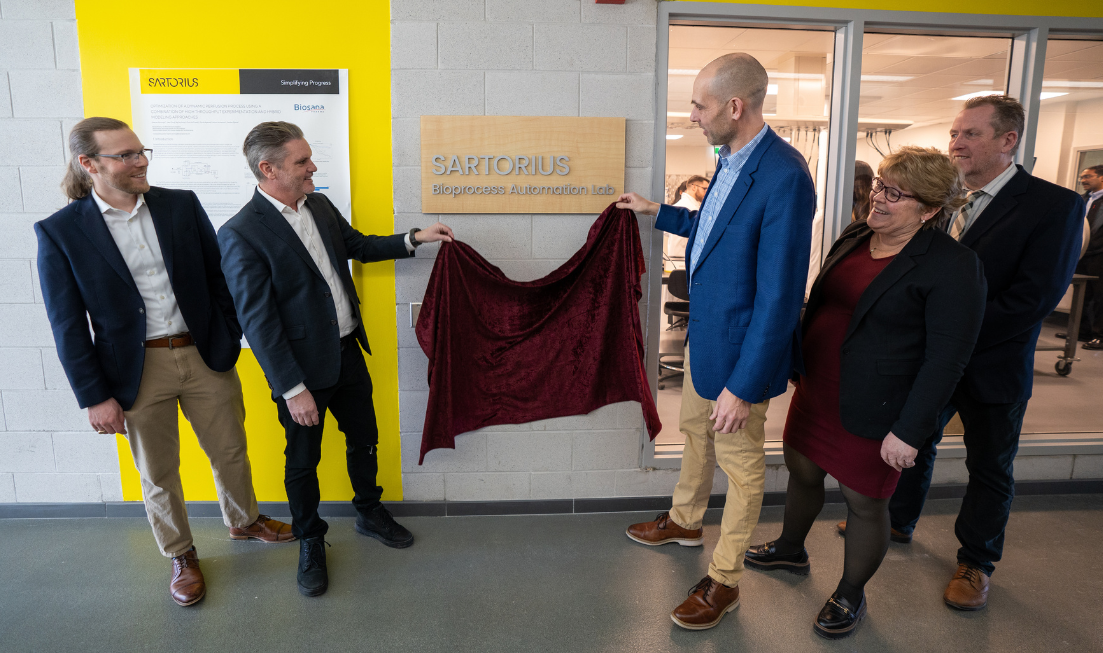 Four men and a women unveil cover from the new the new Sartorius Bioprocess Automation Lab.