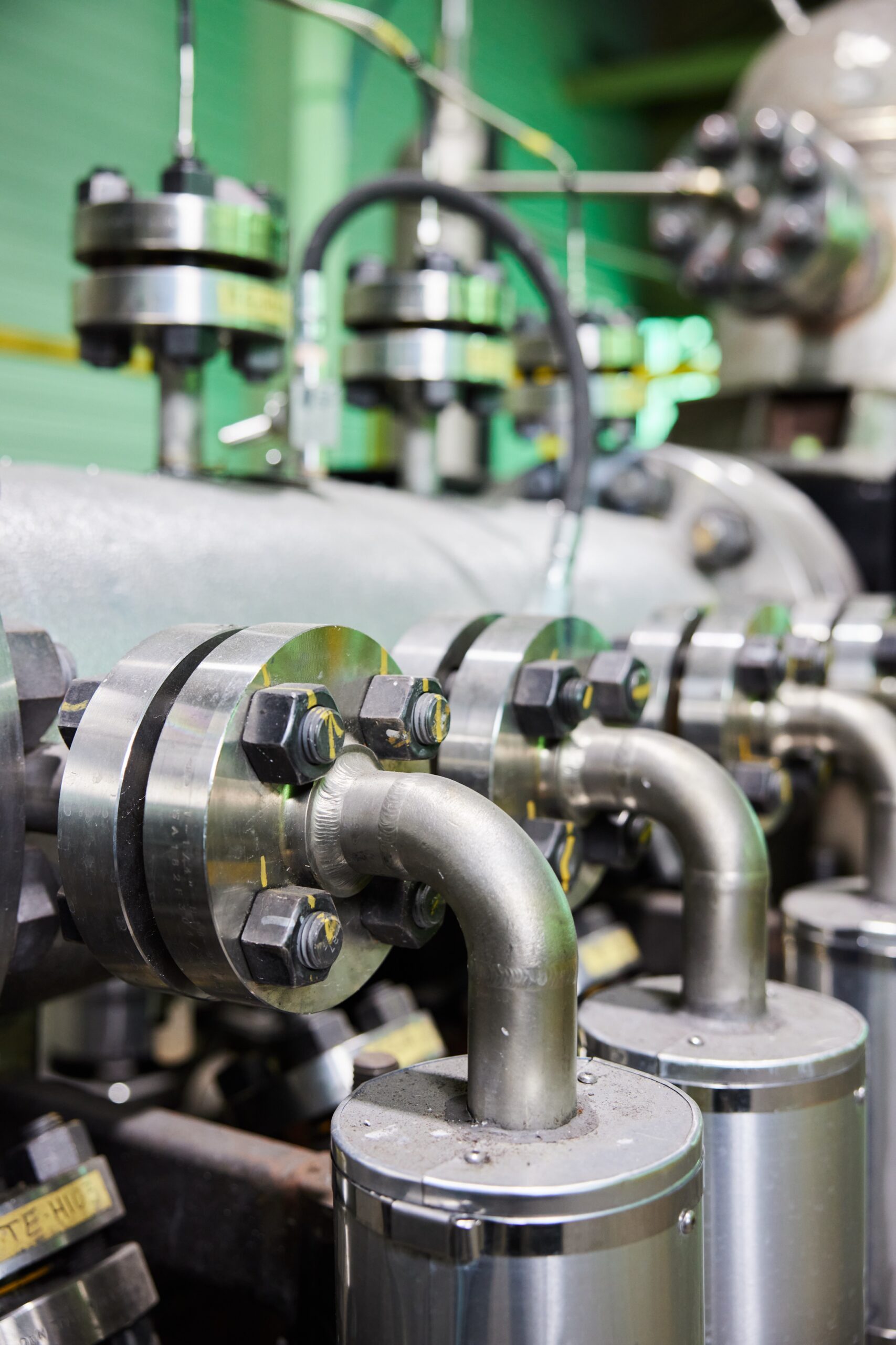 Close-up of GH Power reactor, silver equipment and tubing