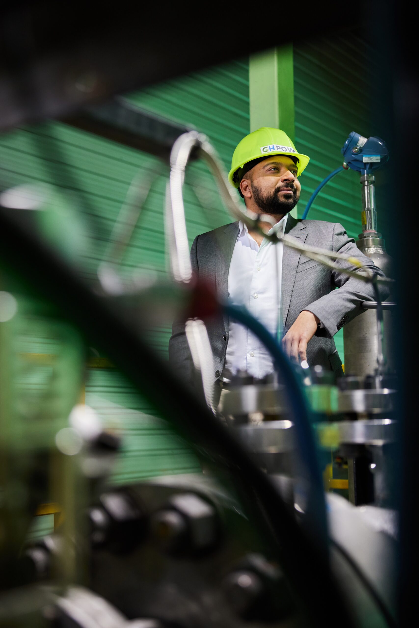 Anand Patel, wearing hardhat in plant