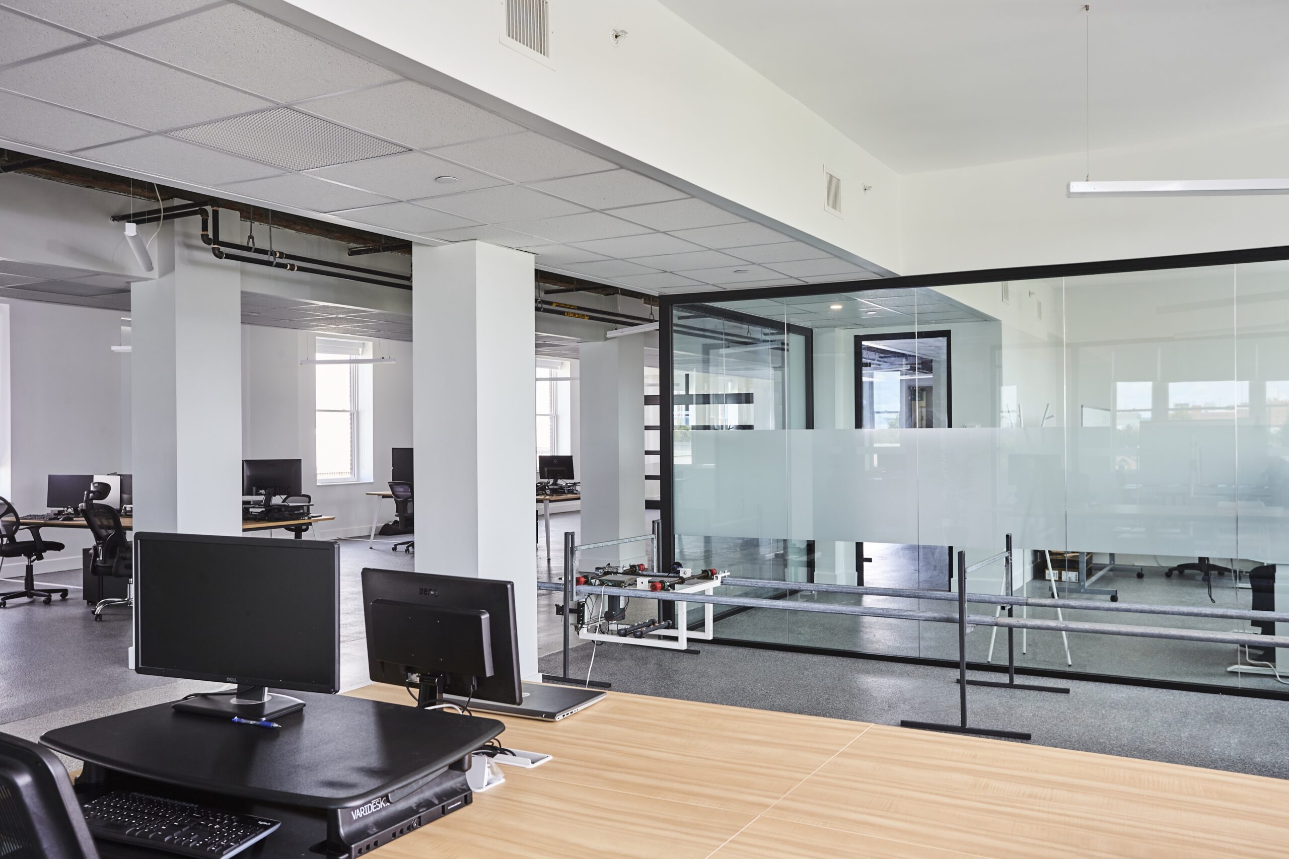 WHQ 4th Floor0722_511573 Modern looking office space with computer monitors and glass walls